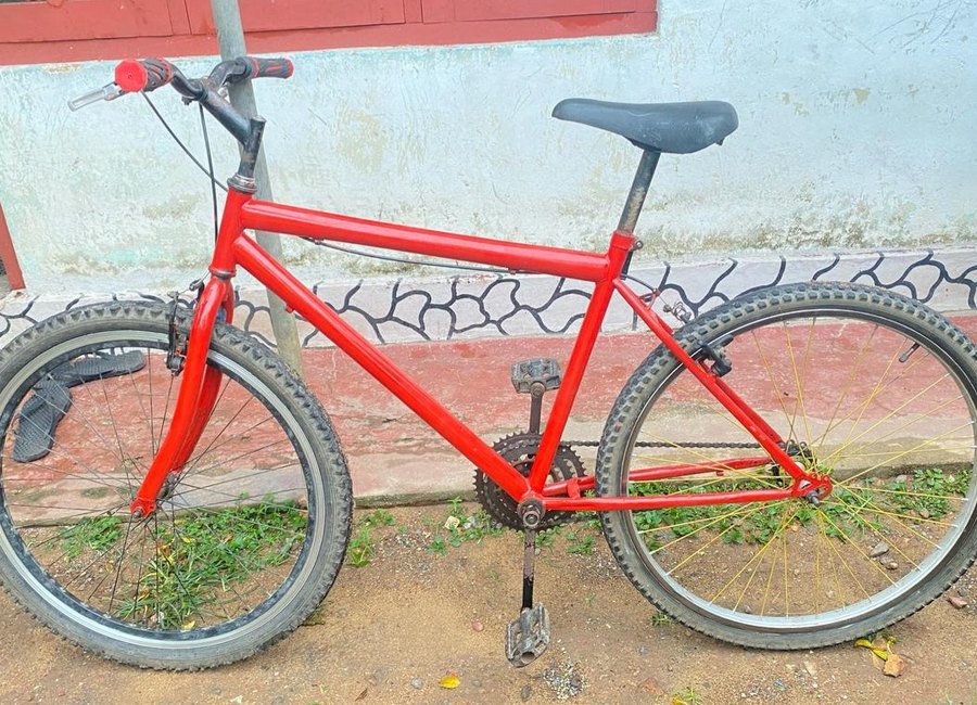 Red bicycle repair completed work
